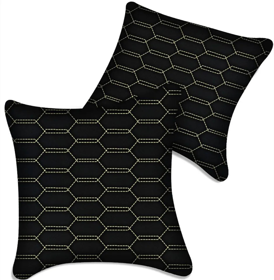 Black leather vehicle pillows with gold stitching